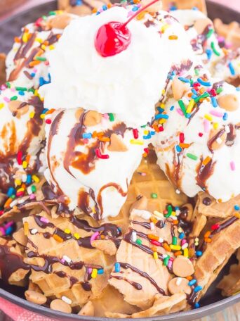 Peanut Butter Ice Cream Sundae Nachos are a deliciously sweet treat for everyone to enjoy. Crunchy waffle cones are sprinkled with sweet ice cream and all of the fun, sundae toppings. Easy to make and and even better to eat, these nachos make the best dessert during the warmer months!