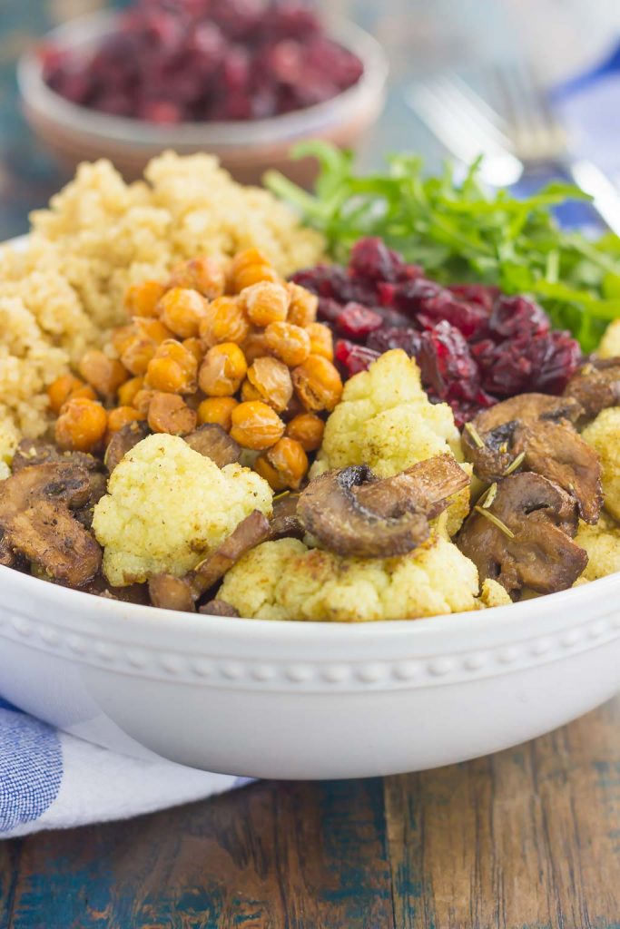 This Roasted Cauliflower, Mushroom and Chickpea Quinoa Bowl is a quick and easy meatless meal that is sure to please everyone. Hearty quinoa is tossed with roasted cauliflower, mushrooms, chickpeas, and arugula, all tossed in a savory white balsamic dressing. This healthier meal is ready in just 30 minutes and packed with delicious superfoods!