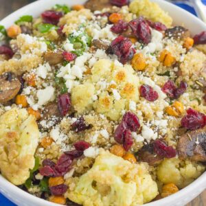 This Roasted Cauliflower, Mushroom and Chickpea Quinoa Bowl is a quick and easy meatless meal that is sure to please everyone. Hearty quinoa is tossed with roasted cauliflower, mushrooms, chickpeas, and arugula, all tossed in a savory white balsamic dressing. This healthier meal is ready in just 30 minutes and packed with delicious superfoods!