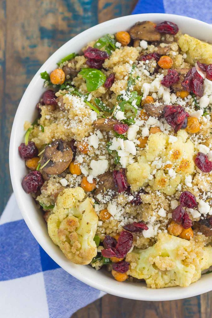 This Roasted Cauliflower, Mushroom and Chickpea Quinoa Bowl is a quick and easy meatless meal that is sure to please everyone. Hearty quinoa is tossed with roasted cauliflower, mushrooms, chickpeas, and arugula, all tossed in a savory white balsamic dressing. This healthier meal is ready in just 30 minutes and packed with delicious superfoods!