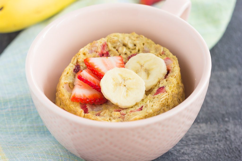 Strawberry banana single serve baked oatmeal in a small pink bowl. 
