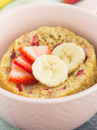 This Strawberry Banana Baked Oatmeal in a Mug is perfect for those busy mornings for when you want a quick and easy breakfast. Packed with hearty oats, fresh fruit and made in the microwave, you can have this baked oatmeal ready in less than five minutes!