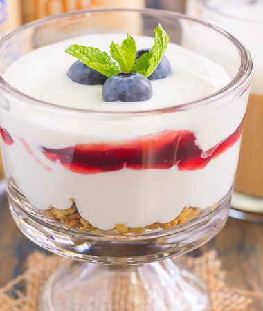 This Blueberry Cheesecake Breakfast Parfait is the best way to start the day. Vanilla Greek yogurt is infused with cream cheese and then layered with blueberries for the ultimate parfait. Light, creamy, and packed with flavor, this easy breakfast or snack is perfect for everyone!