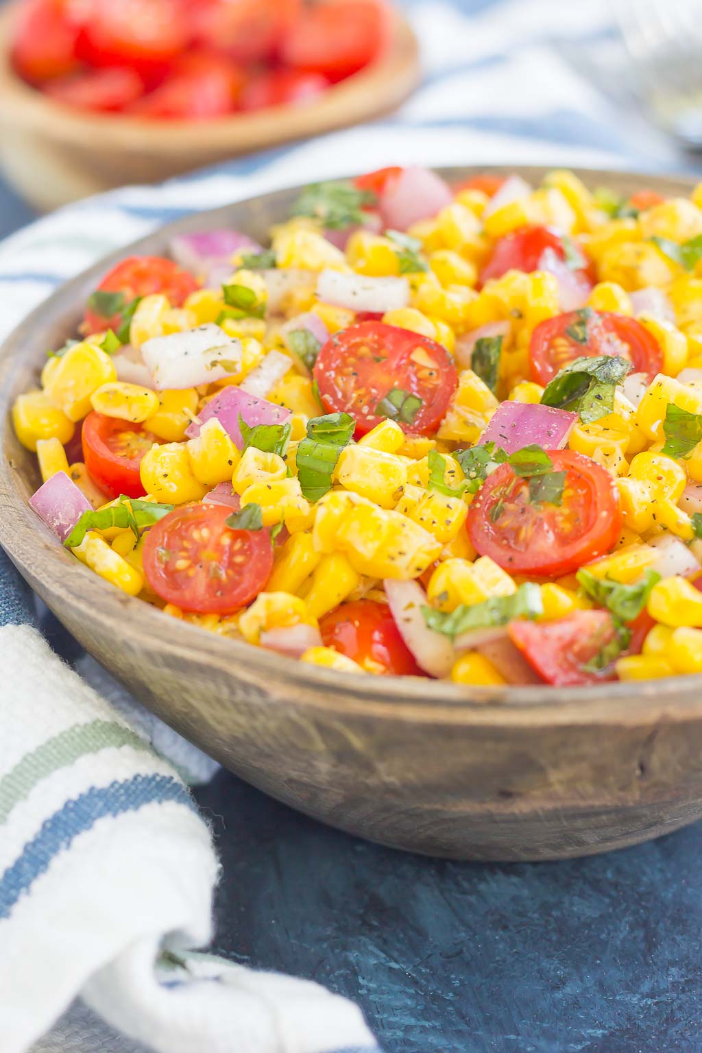With fresh corn cut straight from the cob, cherry tomatoes, spices, and a light dressing, this Corn and Tomato Salad is perfect for a summer lunch or dinner!