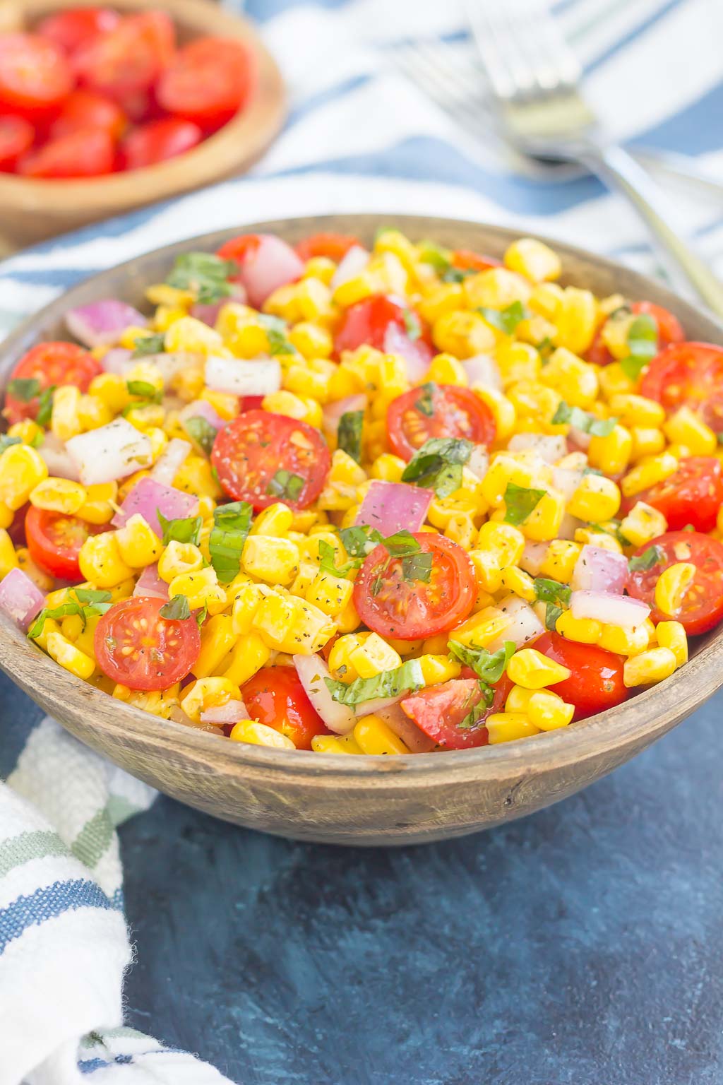 With fresh corn cut straight from the cob, cherry tomatoes, spices, and a light dressing, this Corn and Tomato Salad is perfect for a summer lunch or dinner!