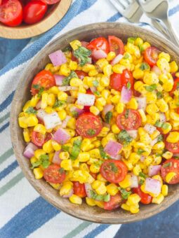 With fresh corn cut straight from the cob, cherry tomatoes, spices, and a light dressing, this Corn and Tomato Salad is perfect for a summer lunch or dinner!