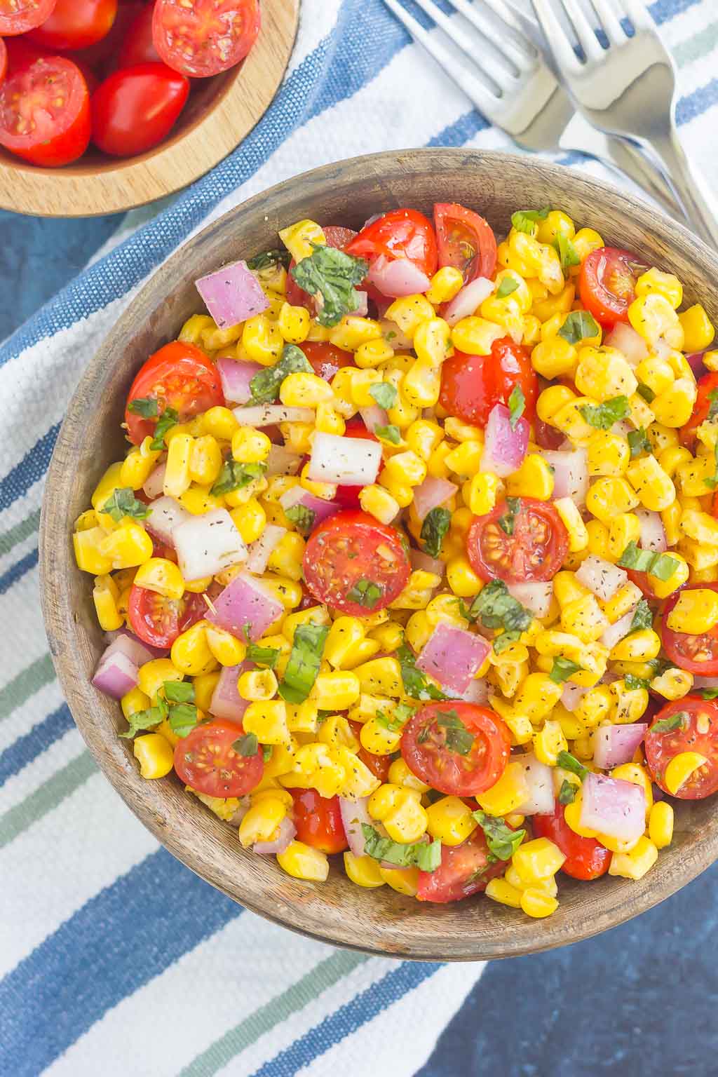 With fresh corn cut straight from the cob, cherry tomatoes, spices, and a light dressing, this Corn and Tomato Salad is perfect for a summer lunch or dinner!