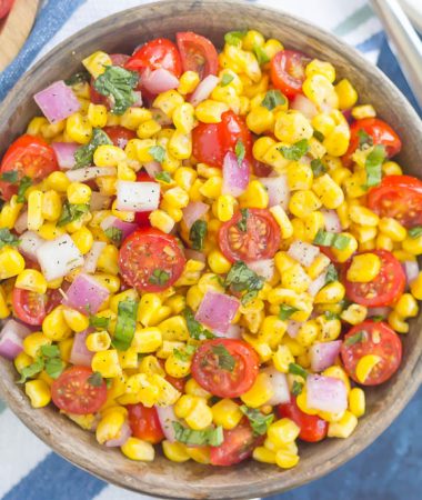 With fresh corn cut straight from the cob, cherry tomatoes, spices, and a light dressing, this Corn and Tomato Salad is perfect for a summer lunch or dinner!