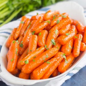 These Maple Brown Sugar Glazed Carrots are simple to prepare and full of warm flavors. The brown sugar and maple syrup creates a sweet glaze that coats the carrots with a welcoming taste!