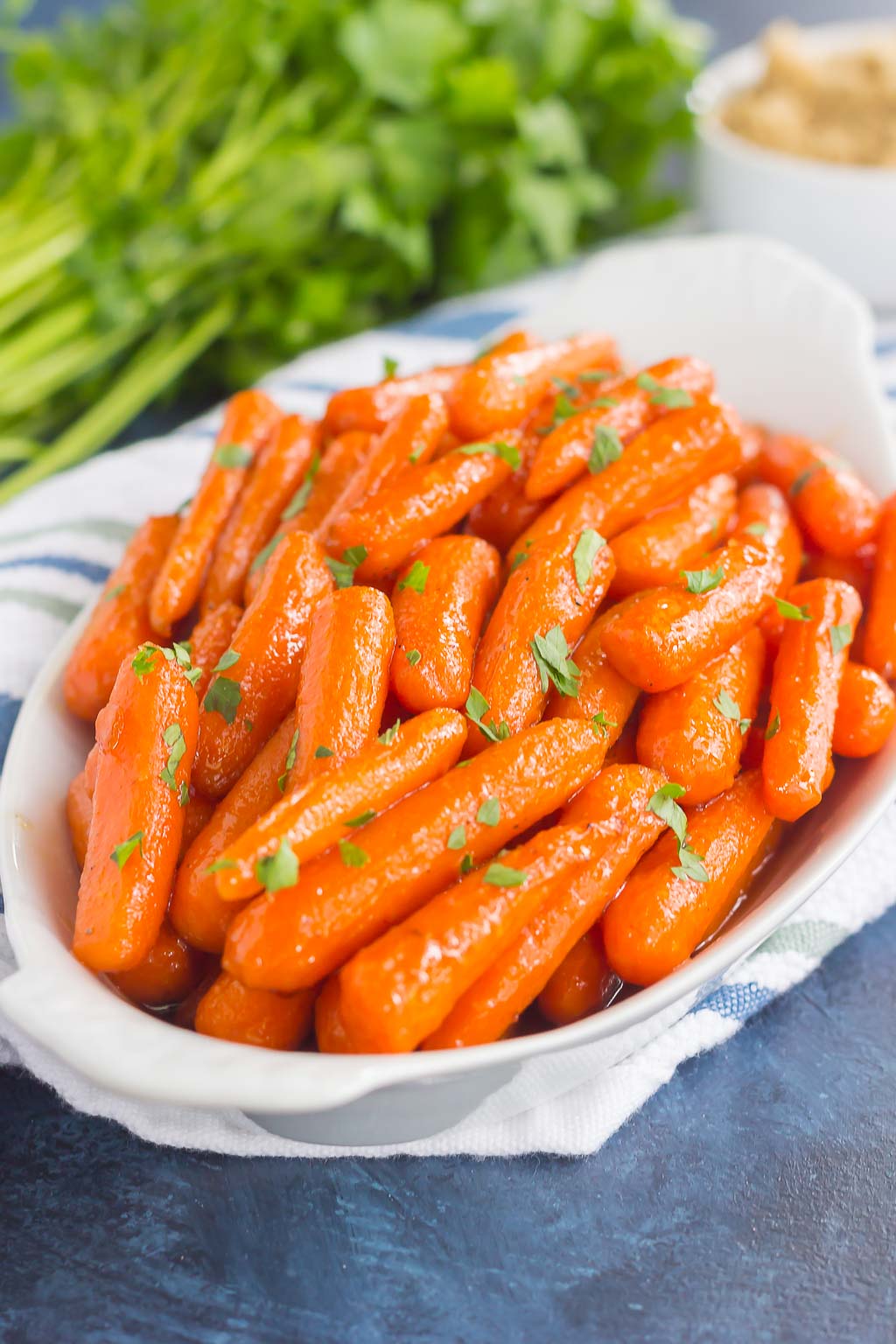 brown sugar baby carrots in a white dish