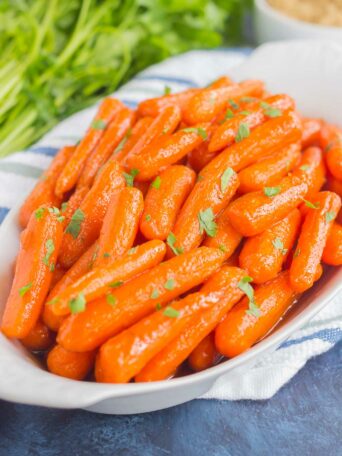These Maple Brown Sugar Glazed Carrots are simple to prepare and full of warm flavors. The brown sugar and maple syrup creates a sweet glaze that coats the carrots with a welcoming taste!