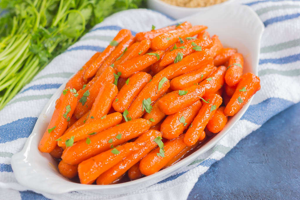 close up of dish of brown sugar maple glazed carrots