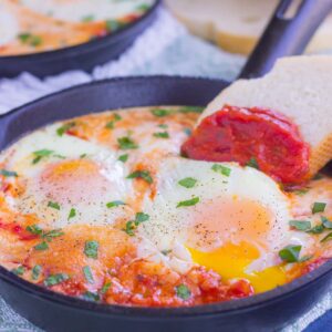 These Marinara Baked Eggs make an easy and hearty meal for busy mornings. Perfect alongside toast, garlic bread, or on its own, this dish is sure to be a favorite all year long!