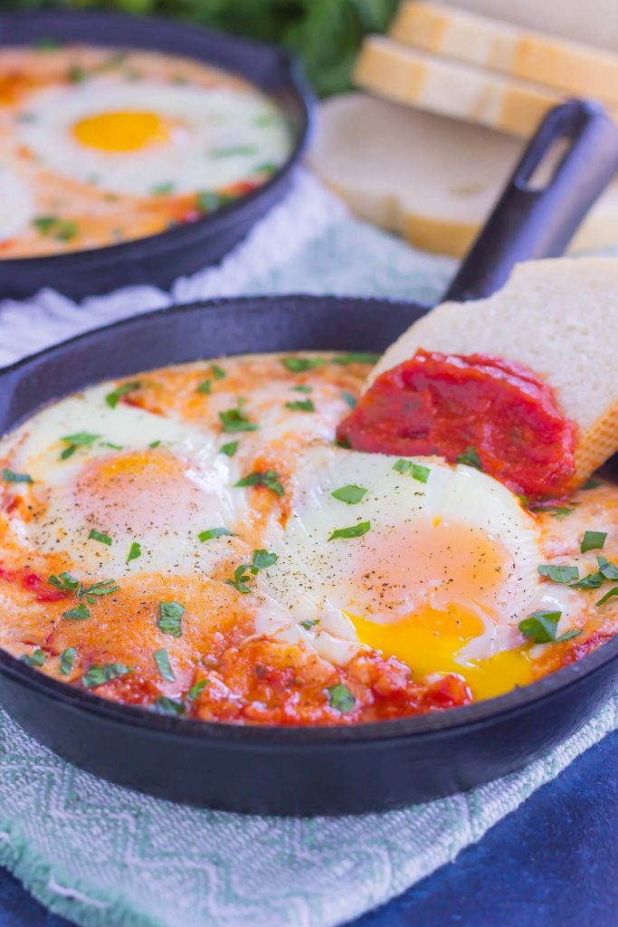 These Marinara Baked Eggs make an easy and hearty meal for busy mornings. Perfect alongside toast, garlic bread, or on its own, this dish is sure to be a favorite all year long!