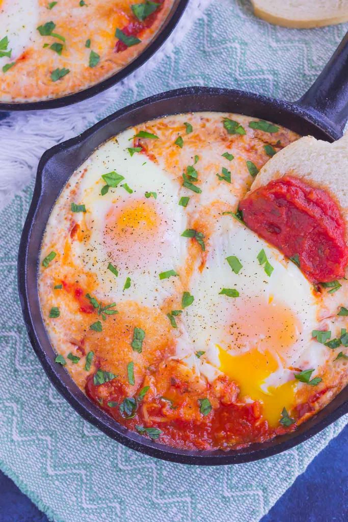 These Marinara Baked Eggs make an easy and hearty meal for busy mornings. Perfect alongside toast, garlic bread, or on its own, this dish is sure to be a favorite all year long!