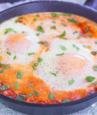 These Marinara Baked Eggs make an easy and hearty meal for busy mornings. Perfect alongside toast, garlic bread, or on its own, this dish is sure to be a favorite all year long!