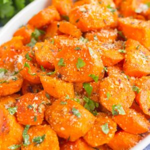 These Parmesan Honey Roasted Carrots make a deliciously easy side dish that's ready in no time. Packed with sweet and savory flavors and roasted until tender, these carrots are fresh, flavorful and perfect alongside any dish!