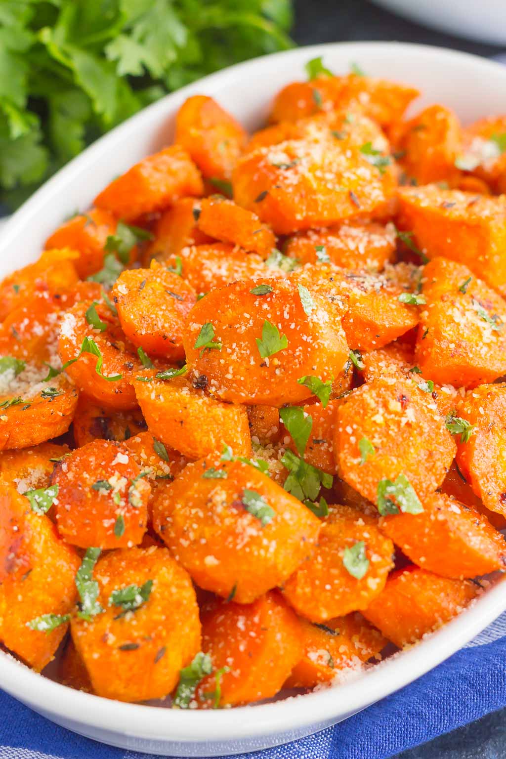 A serving dish full of roasted honey glazed carrots. 