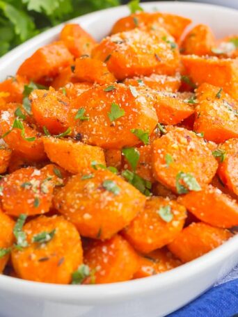 These Parmesan Honey Roasted Carrots make a deliciously easy side dish that's ready in no time. Packed with sweet and savory flavors and roasted until tender, these carrots are fresh, flavorful and perfect alongside any dish!
