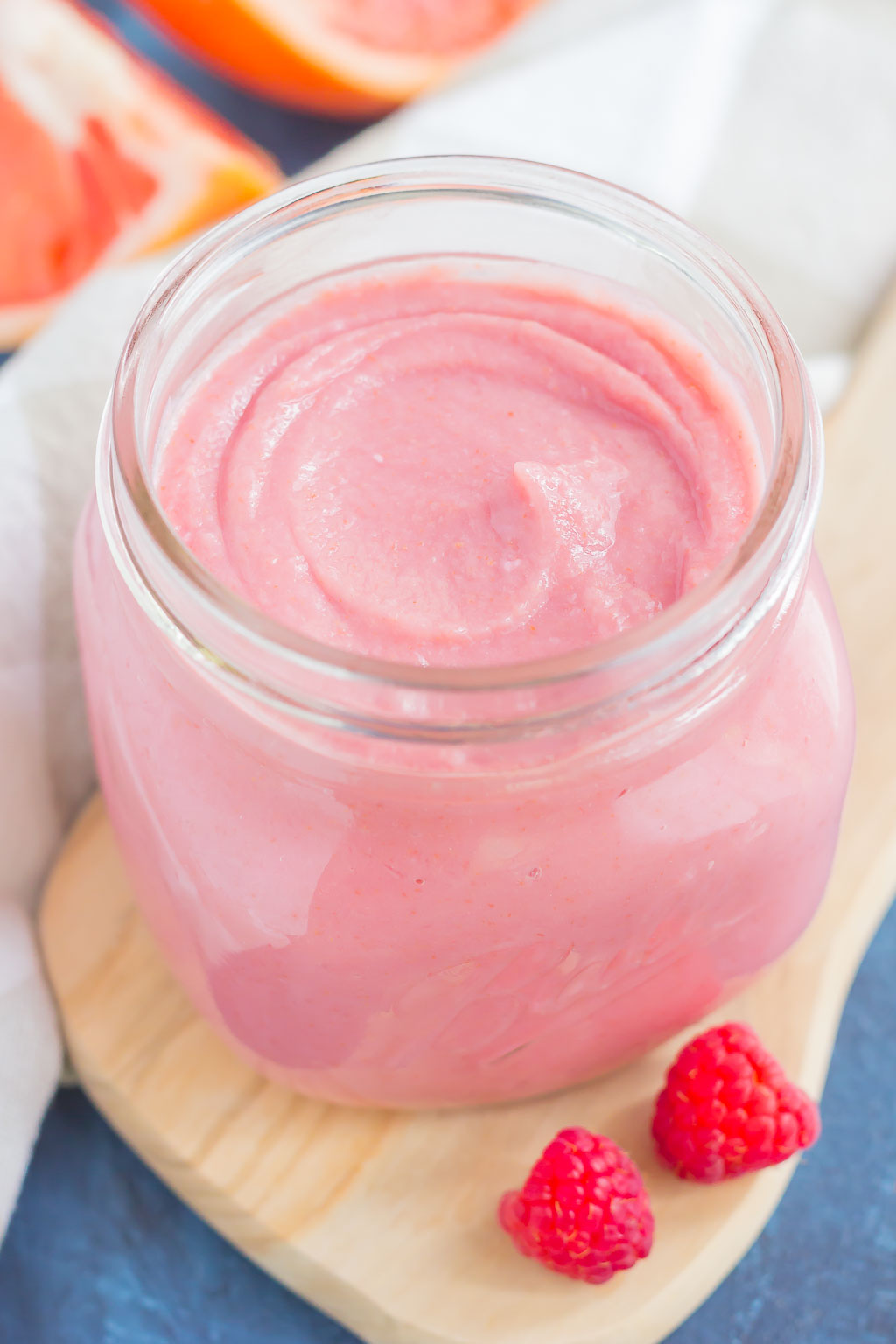 This Raspberry Grapefruit Curd is smooth, silky, and packed with lots of flavor! Fresh raspberries and tangy ruby red grapefruit create a luscious and creamy combination that is decadently delicious. This curd is perfect to serve with toast, pancakes, waffles, oatmeal, or even over ice cream!