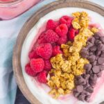 This Raspberry Grapefruit Yogurt Bowl is a delicious way to start the day. It's packed with creamy vanilla Greek yogurt, a swirl of raspberry grapefruit curd, and topped with a combination of sweet ingredients. Fresh, flavorful, and light, this is the best way to switch up your breakfast or snack routine!