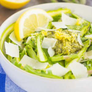 Filled with tender asparagus ribbons, fresh arugula, and a lemony pesto sauce, this Shaved Asparagus Pesto Salad is perfect to enjoy as a main dish or simple side dish. Easy to prepare and with a light and fresh flavor, you'll fall in love with the taste and texture of these fresh greens!
