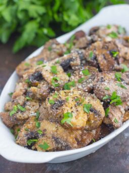 These Baked Parmesan Garlic Mushrooms are seasoned to perfection with garlic, basil, and Parmesan cheese. Easy to prepare and even better to eat, you will be making this side dish all the time!