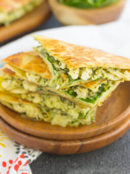 These Chicken and Spinach Pesto Quesadillas are simple to make and ready in less than 20 minutes. Filled with shredded chicken, pesto, baby spinach, and mozzarella cheese, this easy dish is packed with flavor and perfect for busy weeknights!