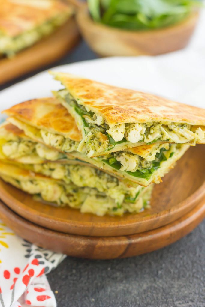 These Chicken and Spinach Pesto Quesadillas are simple to make and ready in less than 20 minutes. Filled with shredded chicken, pesto, baby spinach, and mozzarella cheese, this easy dish is packed with flavor and perfect for busy weeknights!