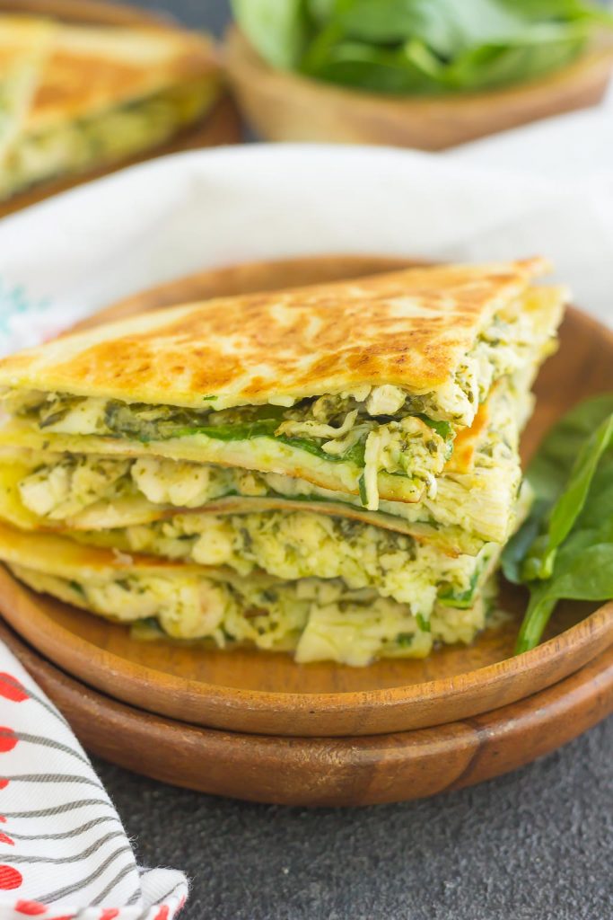 These Chicken and Spinach Pesto Quesadillas are simple to make and ready in less than 20 minutes. Filled with shredded chicken, pesto, baby spinach, and mozzarella cheese, this easy dish is packed with flavor and perfect for busy weeknights!