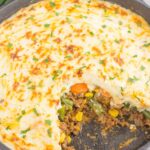 This Easy Shepherd's Pie features a unique spin on the classic version and is ready in less than 20 minutes. Loaded with zesty ground beef, cheddar cheese, mixed veggies, and topped with creamy, cheesy mashed potatoes, this is the ultimate comfort dish for everyone to enjoy!