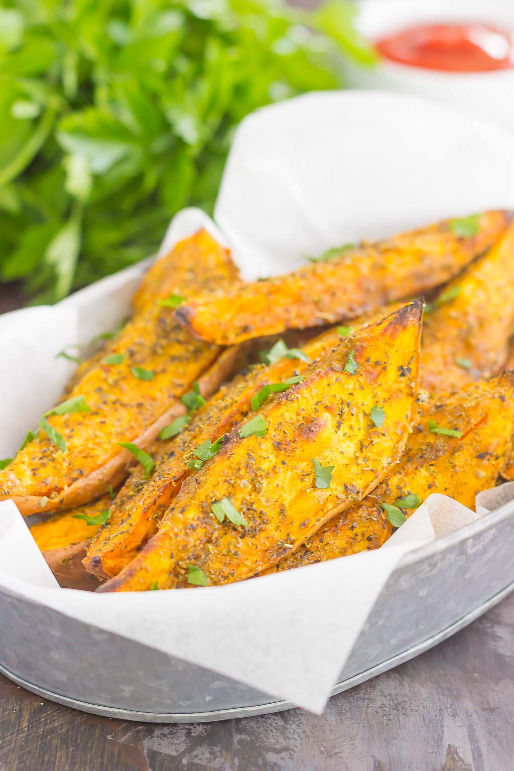 These Garlic Herb Sweet Potato Wedges are loaded with flavor and baked until crispy and golden. Made with just a few simple ingredients and ready in no time, these wedges are the perfect side dish for just about any meal!