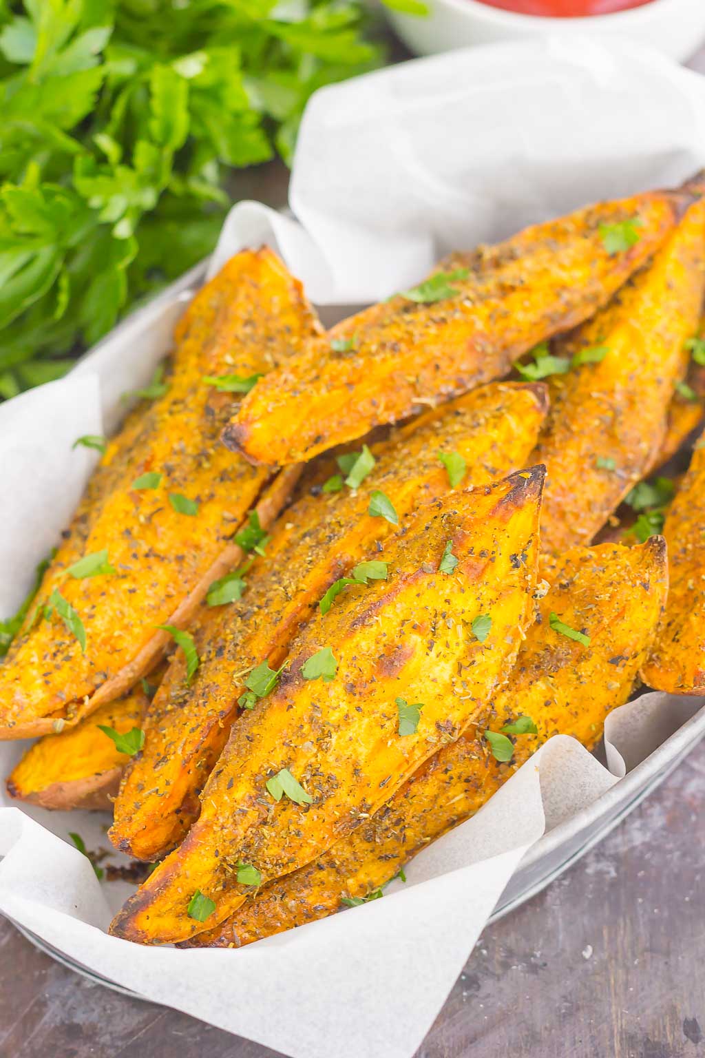 These Garlic Herb Sweet Potato Wedges are loaded with flavor and baked until crispy and golden. Made with just a few simple ingredients and ready in no time, these wedges are the perfect side dish for just about any meal!