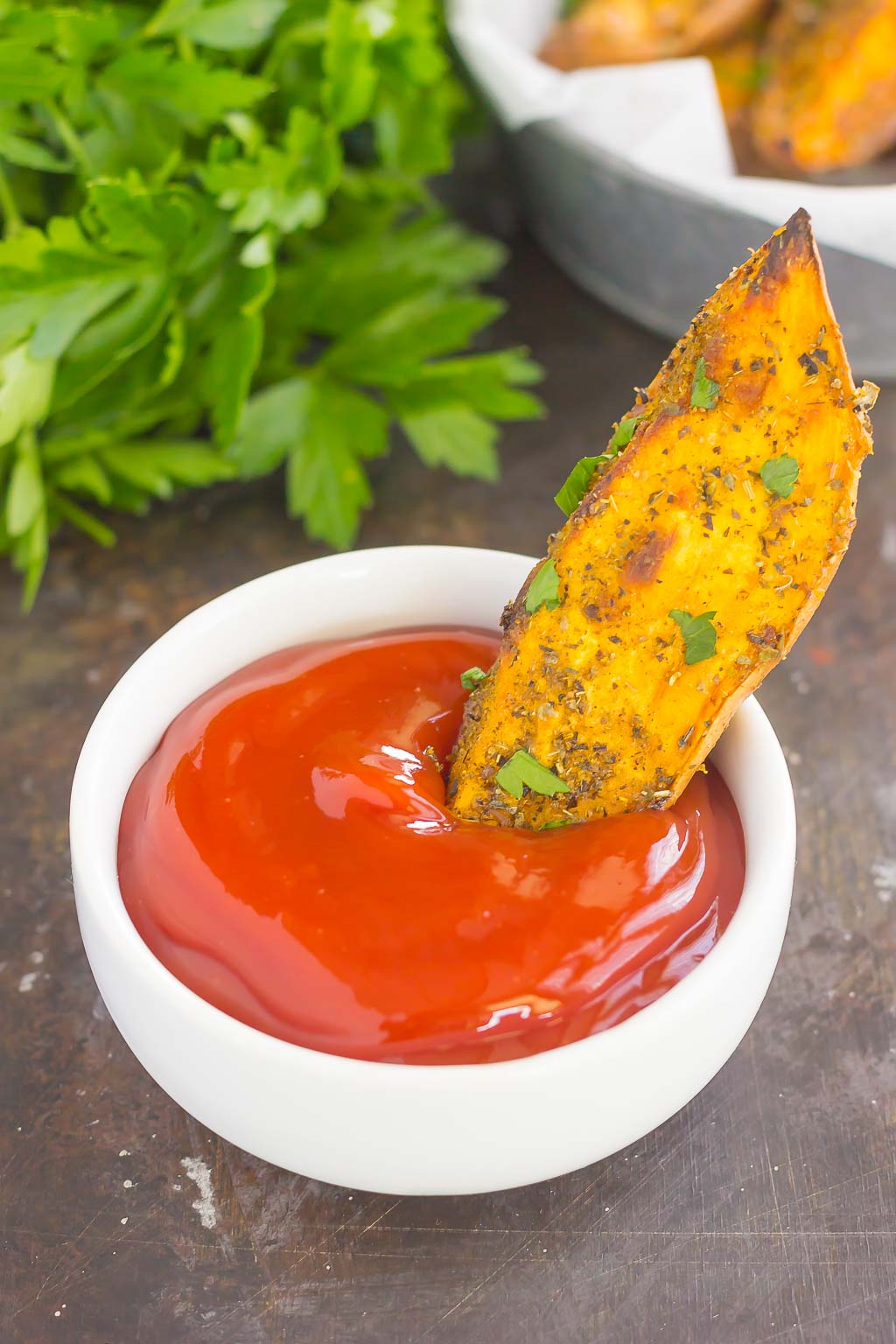 These Garlic Herb Sweet Potato Wedges are loaded with flavor and baked until crispy and golden. Made with just a few simple ingredients and ready in no time, these wedges are the perfect side dish for just about any meal!