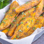 These Garlic Herb Sweet Potato Wedges are loaded with flavor and baked until crispy and golden. Made with just a few simple ingredients and ready in no time, these wedges are the perfect side dish for just about any meal!