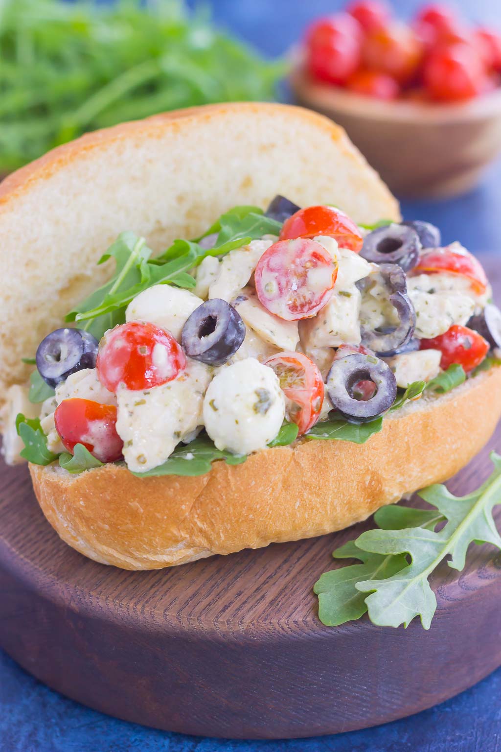 A sub roll filled with Italian pesto chicken salad. 