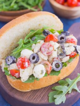 This Italian Chicken Salad is fresh, easy, and bursting with flavor. Loaded with mozzarella cheese, tomatoes, black olives and pesto, this fun twist on a classic flavor will have you coming back for more. This salad is perfect for an easy lunch or dinner and makes delicious sandwiches, too!