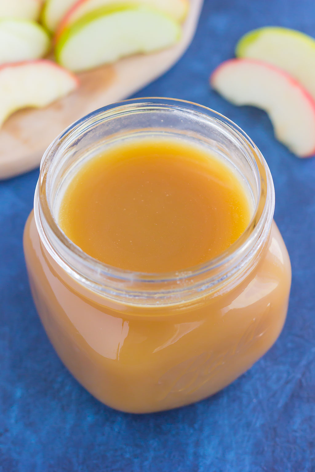 Sweet, smooth, and full of flavor, this Salted Caramel Sauce is just itching to be poured over ice cream, drizzled over pancakes, or eaten with spoon! #caramel #caramelsauce #caramelrecipe #saltedcaramelsauce #saltedcaramelrecipe #saltedcaramel #fallrecipe #falldessert #icecreamtopping 