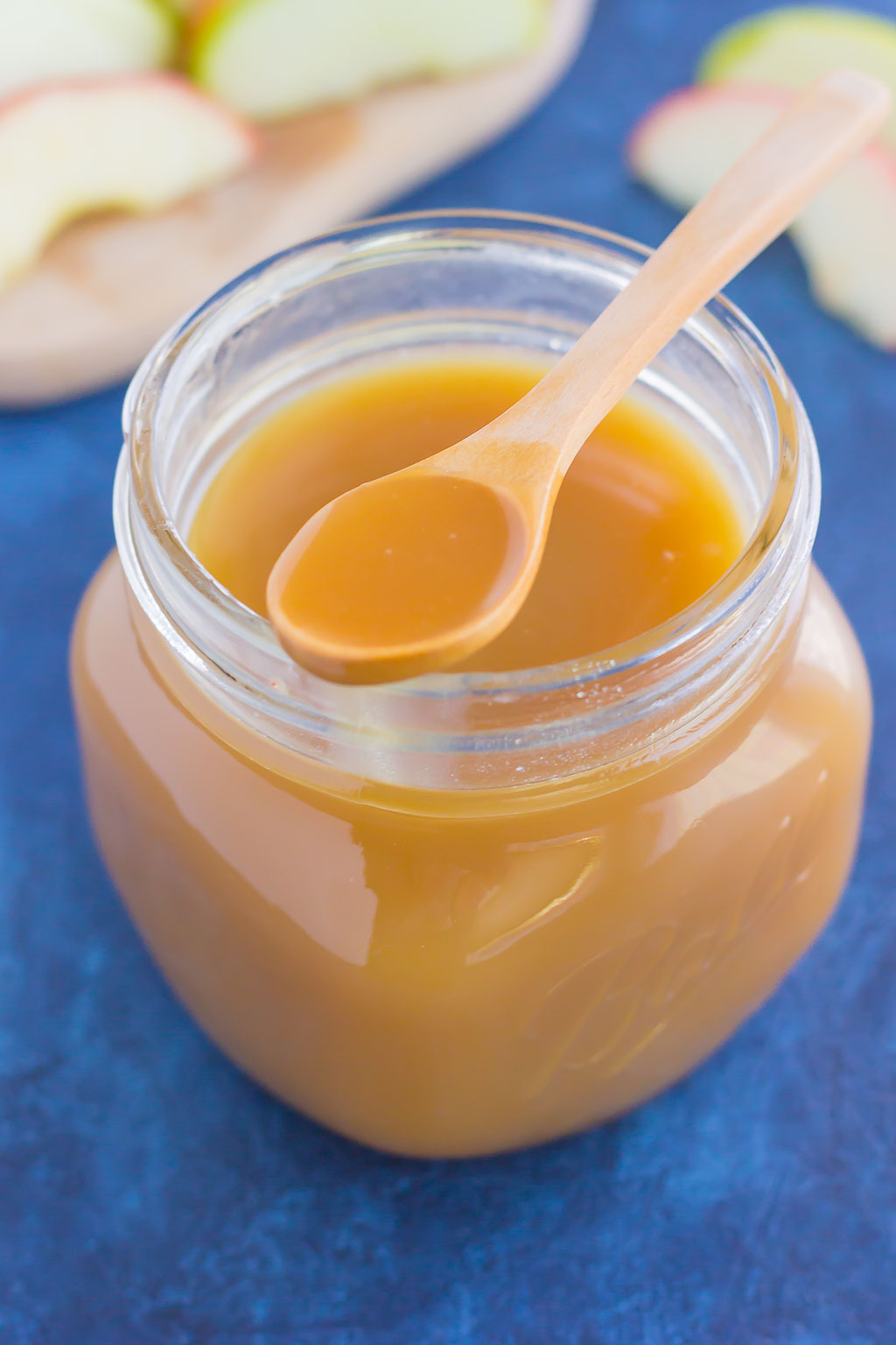 Sweet, smooth, and full of flavor, this Salted Caramel Sauce is just itching to be poured over ice cream, drizzled over pancakes, or eaten with spoon! #caramel #caramelsauce #caramelrecipe #saltedcaramelsauce #saltedcaramelrecipe #saltedcaramel #fallrecipe #falldessert #icecreamtopping 