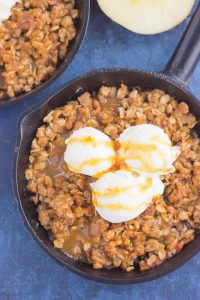 top down shot of caramel apple crisp with vanilla ice cream