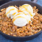 caramel apple crisp with vanilla ice cream on top