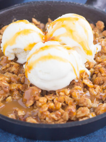 caramel apple crisp with vanilla ice cream on top