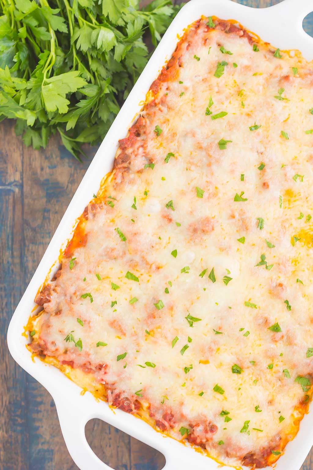 This Easy Baked Ziti is made with simple ingredients, full of flavor, and ready in less than an hour. Loaded with an easy meat sauce, tender pasta, and three types of cheese, this comfort dish is sure to be a dinnertime crowd-pleaser!