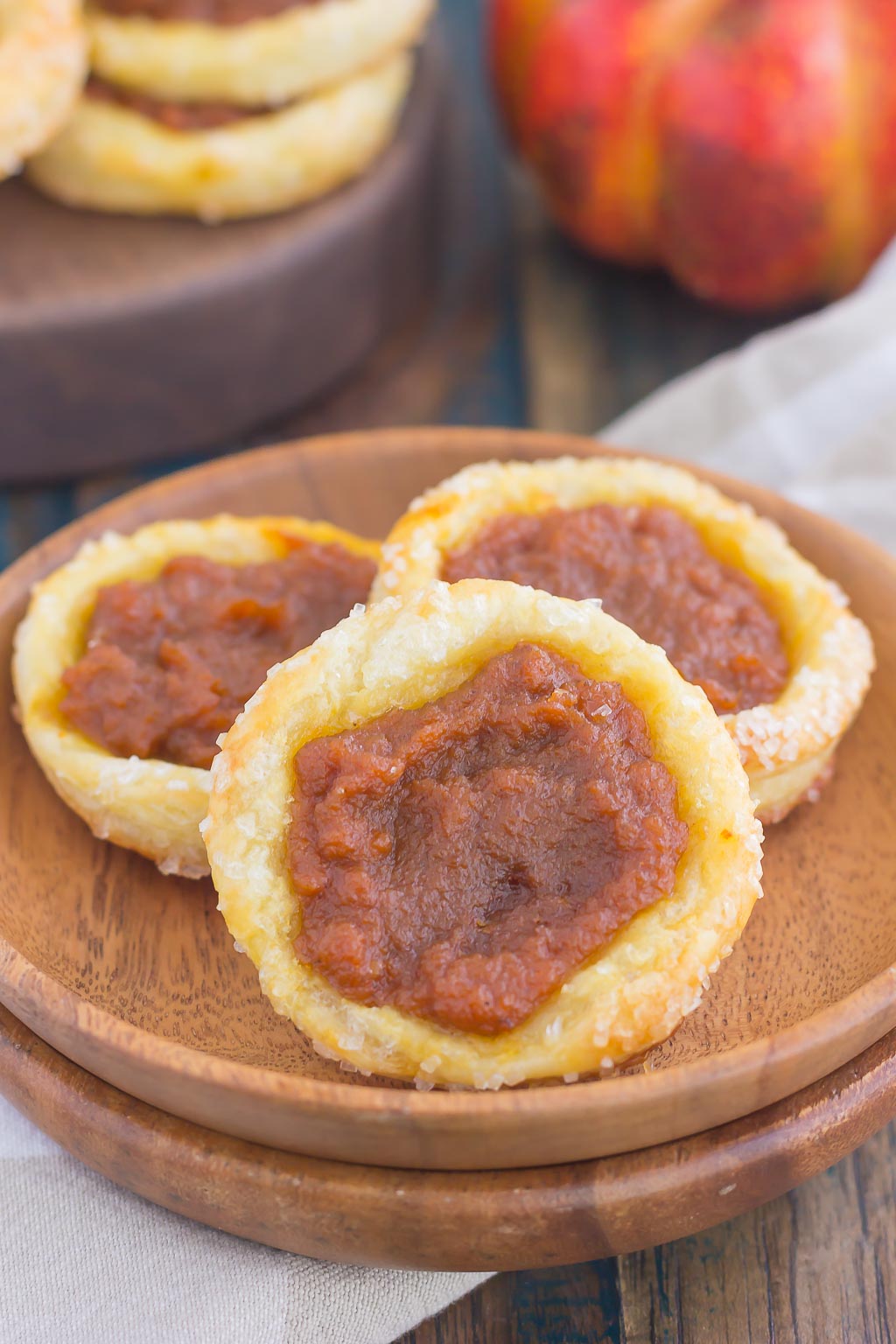 These Easy Pumpkin Danish are filled with a sweet pumpkin mixture that's swirled with cinnamon and brown sugar. Made from a puff pastry base and simple ingredients, you can have this easy breakfast or dessert ready in less than 30 minutes! #pumpkinrecipe #pumpkin #danish #pumpkindanish #danishrecipe #fallbreakfast #falldessert #pumpkindessert #pumpkinbreakfast #dessert