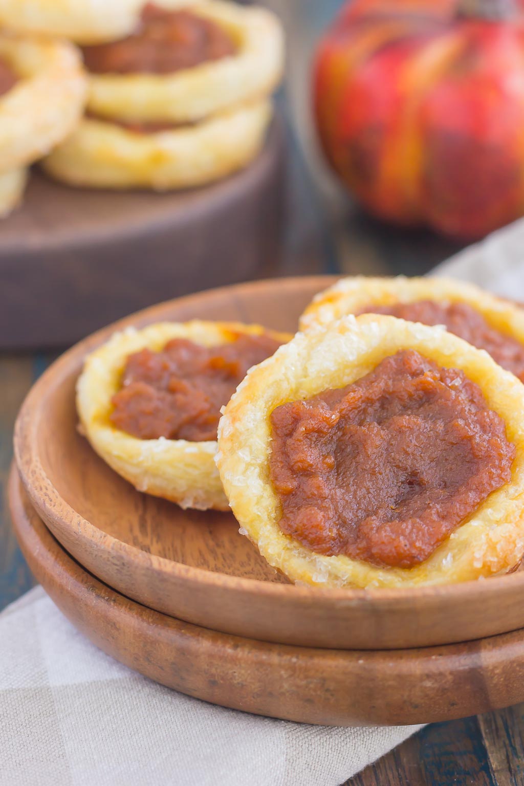 These Easy Pumpkin Danish are filled with a sweet pumpkin mixture that's swirled with cinnamon and brown sugar. Made from a puff pastry base and simple ingredients, you can have this easy breakfast or dessert ready in less than 30 minutes! #pumpkinrecipe #pumpkin #danish #pumpkindanish #danishrecipe #fallbreakfast #falldessert #pumpkindessert #pumpkinbreakfast #dessert