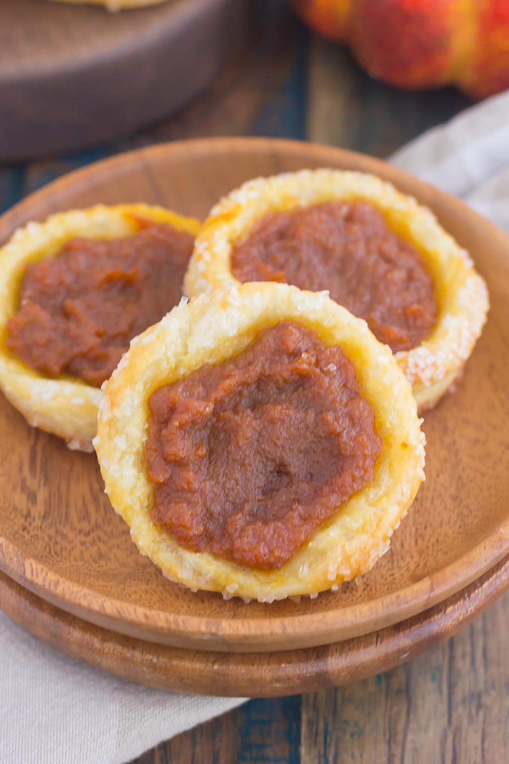 These Easy Pumpkin Danish are filled with a sweet pumpkin mixture that's swirled with cinnamon and brown sugar. Made from a puff pastry base and simple ingredients, you can have this easy breakfast or dessert ready in less than 30 minutes! #pumpkinrecipe #pumpkin #danish #pumpkindanish #danishrecipe #fallbreakfast #falldessert #pumpkindessert #pumpkinbreakfast #dessert