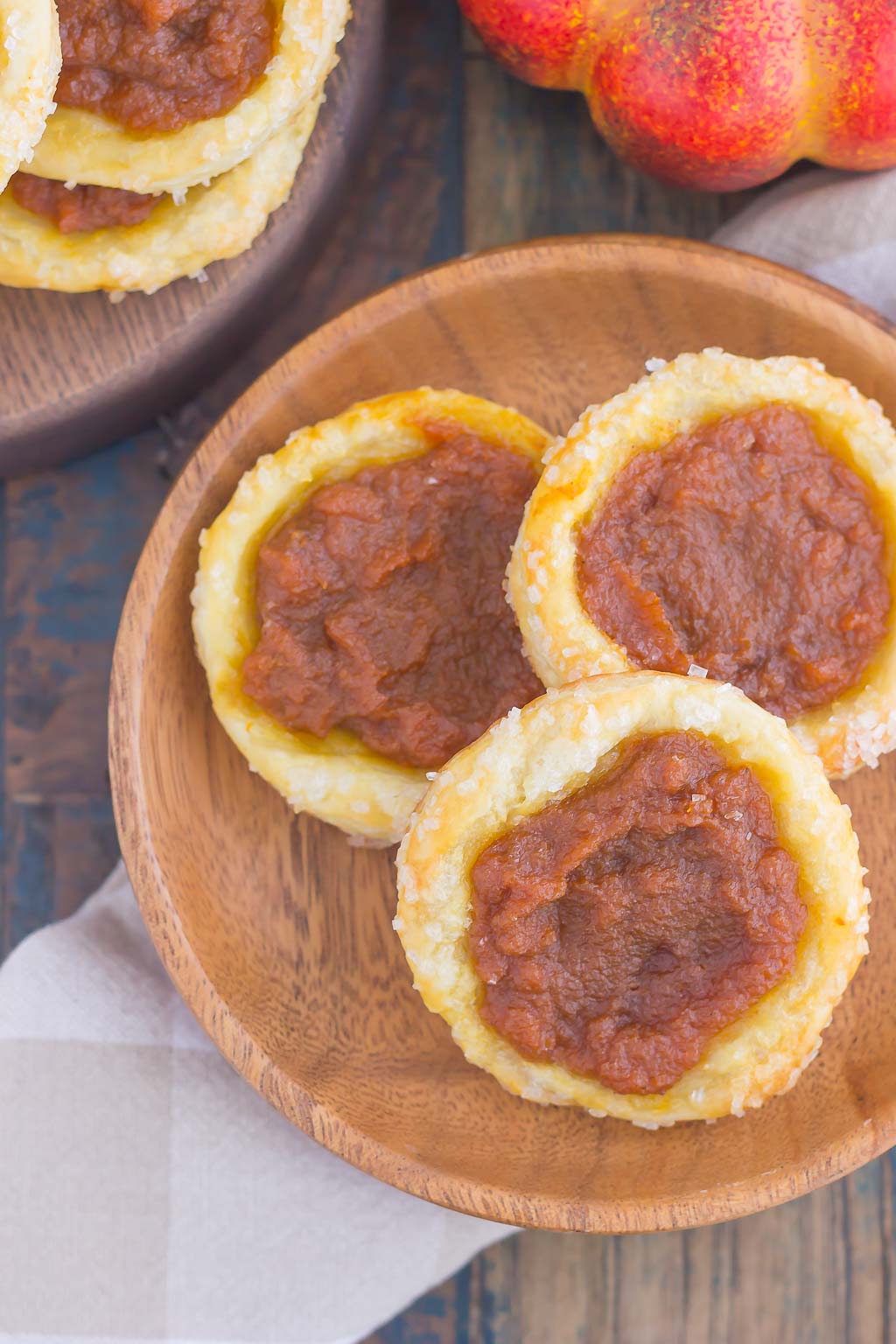 These Easy Pumpkin Danish are filled with a sweet pumpkin mixture that's swirled with cinnamon and brown sugar. Made from a puff pastry base and simple ingredients, you can have this easy breakfast or dessert ready in less than 30 minutes! #pumpkinrecipe #pumpkin #danish #pumpkindanish #danishrecipe #fallbreakfast #falldessert #pumpkindessert #pumpkinbreakfast #dessert