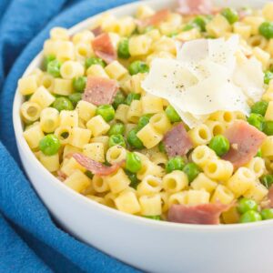 Garlic Butter Pasta with Prosciutto and Peas is a simple dish that's ready in less than 30 minutes. Filled with tender pasta, crispy prosciutto, peas, and a garlic butter sauce, this meal is packed simple ingredients and perfect for the whole family to enjoy!