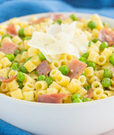 Garlic Butter Pasta with Prosciutto and Peas is a simple dish that's ready in less than 30 minutes. Filled with tender pasta, crispy prosciutto, peas, and a garlic butter sauce, this meal is packed simple ingredients and perfect for the whole family to enjoy! 