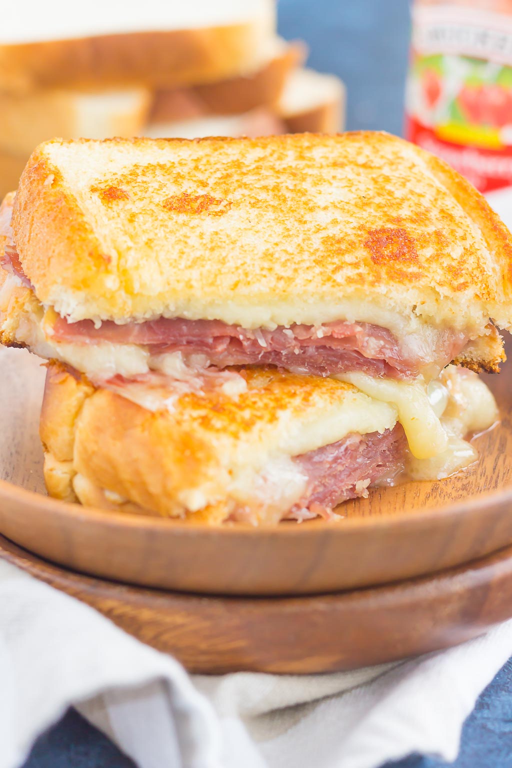 This Prosciutto, Raspberry and Brie Grilled Cheese is loaded with fresh slices of prosciutto, raspberry jam, brie and mozzarella cheeses. Grilled until golden and melty, this sandwich is the perfect comfort dish! #grilledcheese #grilledcheeserecipe #sandwich #prosciuttosandwich #prosciuttogrilledcheese #briegrilledcheese #maindish #lunch